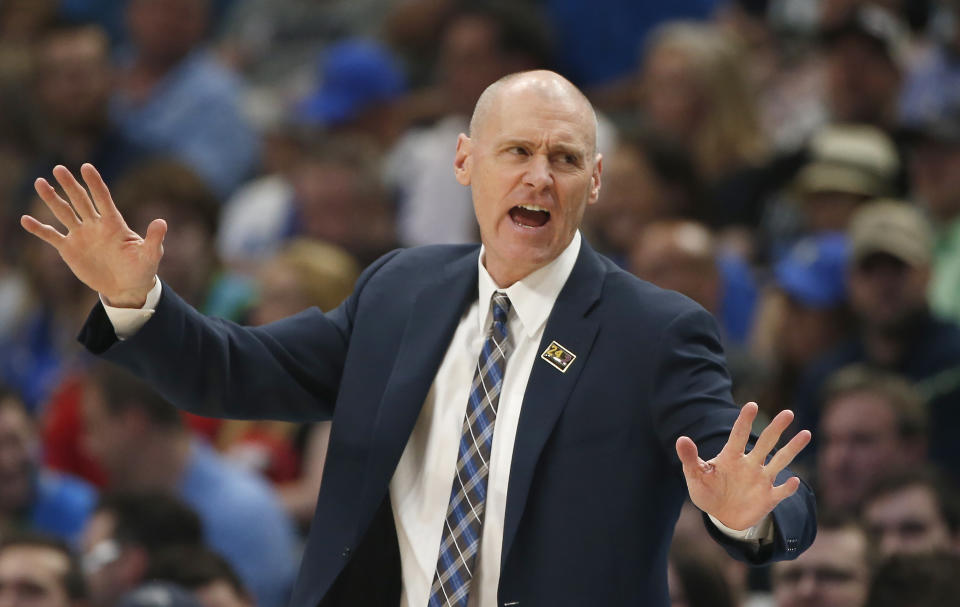 Dallas Mavericks coach Rick Carlisle gestures during the first half of the team's NBA basketball game against the Denver Nuggets, Wednesday, March 11, 2020, in Dallas. The Mavericks won 113-97. (AP Photo/Ron Jenkins)