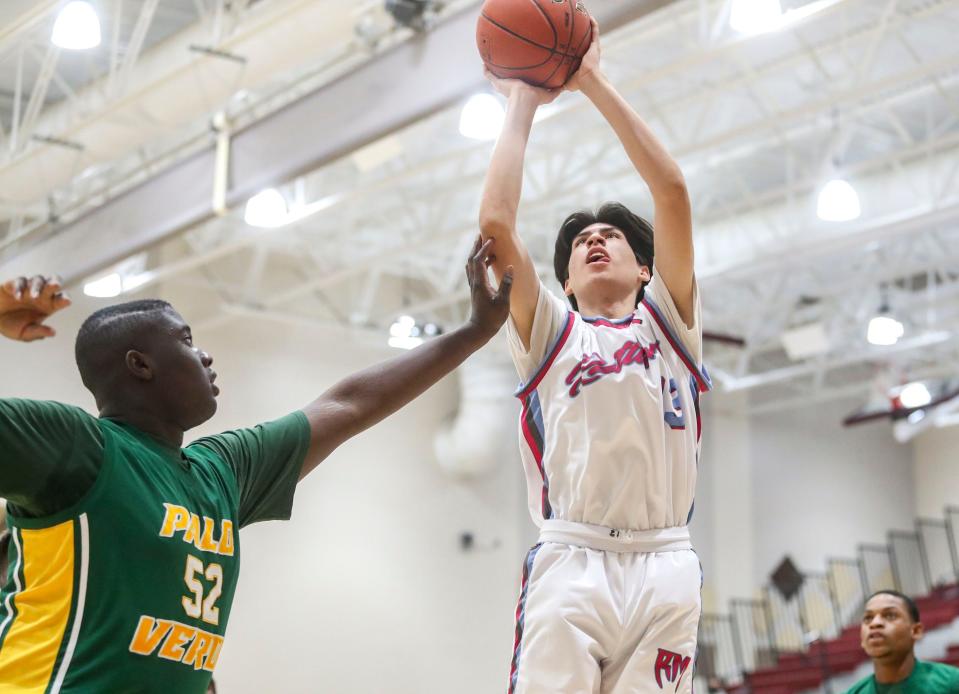 Rancho Mirage's Adan Jacquez (13) shoots over Palo Verde's Emmanuel Nwisu (52) during the first period of their game at Rancho Mirage High School, Tuesday, Dec. 28, 2021, in Rancho Mirage, Calif. 