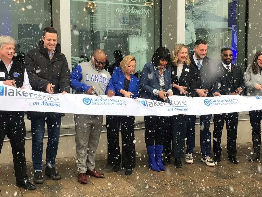 Local and university leaders at a ribbon-cutting ceremony at the new Grand Valley State University downtown Grand Rapids Laker Store. (March 22, 2024)