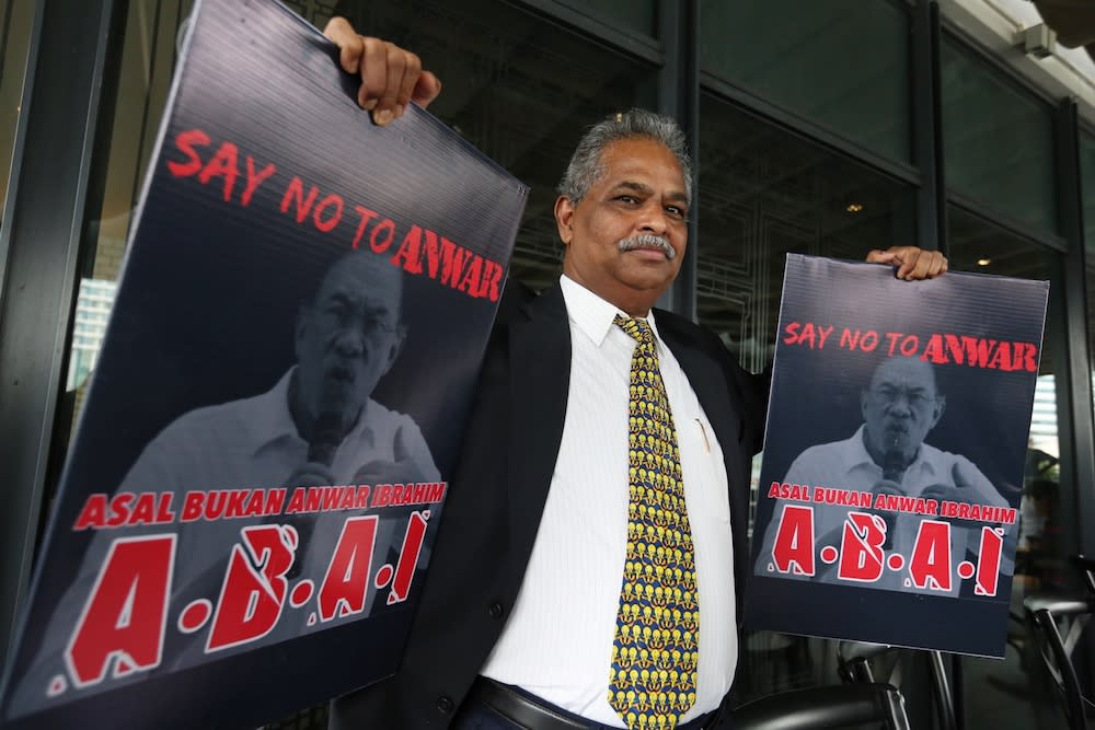 P. Ganapathy holds placards with the slogan ‘ABAI — Asalkan Bukan Anwar Ibrahim’ during a press conference in Kuala Lumpur July 19, 2019. — Picture by Choo Choy May