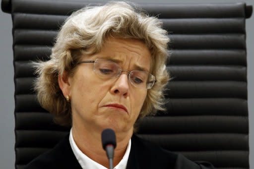 Professional judge Wenche Elizabeth Arntzen reads out the judgment against Anders Behring Breivik in Oslo on Friday, sentencing him to 21 years in prison, which can be extended indefinitely, for the killings of 77 people in July last year