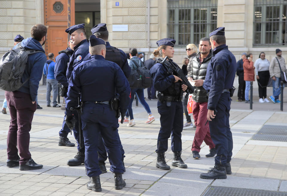 Police officers patrol outside the police headquarters in Paris, Friday, Oct. 4, 2019. The French government says there is nothing to suggest the police employee who stabbed four colleagues to death at Paris police headquarters yesterday was radicalized. (AP Photo/Michel Euler)