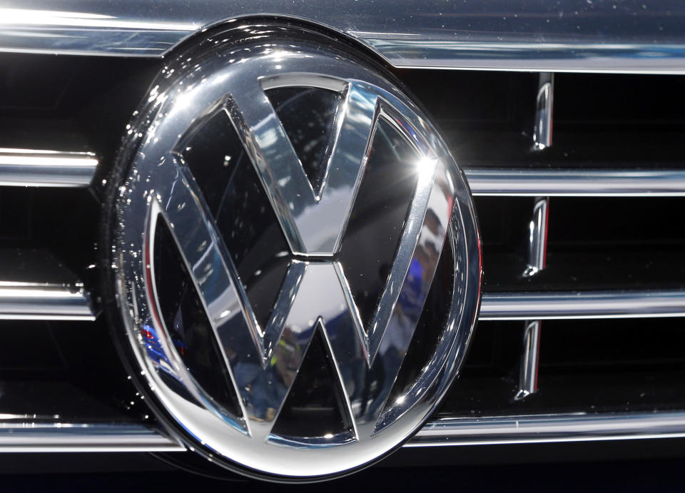 FILE - In this Sept. 22, 2015, file photo, the logo of Volkswagen at a car is photographed during the Car Show in Frankfurt, Germany. Luxury brands Audi and Porsche are fattening the bottom line at German automaker Volkswagen. The company's premium brands saw record sales in the first half of the year. That helped the Wolfsburg-based auto giant make more money than it did even before the pandemic. The company made 11.4 billion euros, or $13.5 billion, in the first half of the year.(AP Photo/Michael Probst, File)