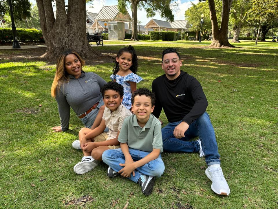 Gleydis Gonzalez, here with her family, is a senior recovery specialist at Synchrony Financial, based in Stamford, Conn. "Child care benefits provided by Synchrony allows us to have peace of mind while working," she says.