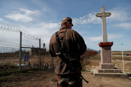 A Hungarian soldier stands at the Hungarian-Serbian border near to the village of Bacsszentgyorgy, Hungary, April 3, 2018. REUTERS/Bernadett Szabo