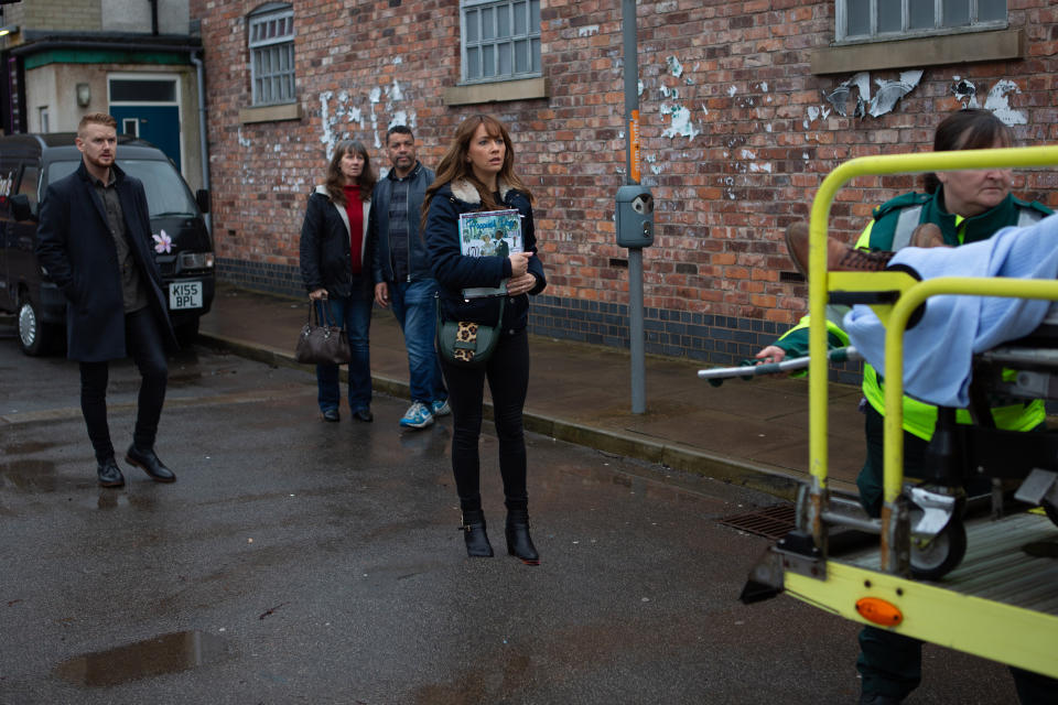 Maria Connor [SAMIA LONGCHAMBON] and Gary Windass [MIKEY NORTH] watch in horror as Ali Neeson [JAMES BURROWS] is loaded into an ambulance.   (ITV Plc)