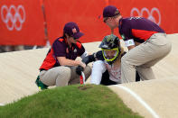 LONDON, ENGLAND - AUGUST 08: Brooke Crain of the United States is helped up after falling during the Women's BMX Cycling on Day 12 of the London 2012 Olympic Games at BMX Track on August 8, 2012 in London, England. (Photo by Phil Walter/Getty Images)