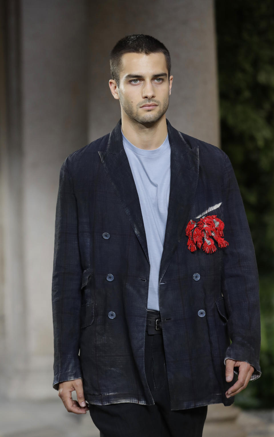 A model wears a creation as part of the Armani men's Spring-Summer 2020 collection, unveiled during the fashion week, in Milan, Italy, Monday, June 17, 2019. (AP Photo/Luca Bruno)