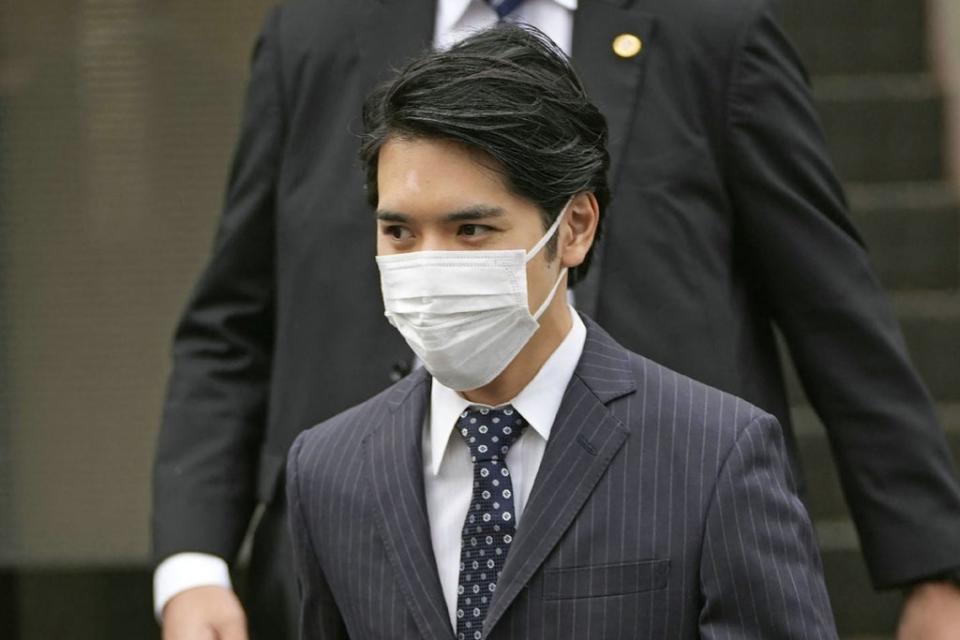 Kei Komuro leaves his house in Yokohama ahead of the wedding (JAPAN POOL/AFP via Getty Images)