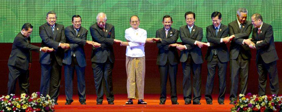 CORRECTS THE ID OF VIETNAMESE LEADER - Leaders of the Association of Southeast Asian Nations pose for a photograph during the opening ceremony of the 24th ASEAN leaders Summit in Naypyitaw, Myanmar, Sunday, May 11 2014. Leaders from left are, Laotian Prime Minister Thongsing Thammavong, Indonesian President Susilo Bambang Yudhoyono, Cambodian Prime Minister Hun Sen, Malaysian Prime Minister Najib Razak, Myanmar President Thein Sein, Sultan of Brunei Hassanal Bolkiah, Vietnamese Prime Minister Nguyen Tan Dung, Thailand Deputy Prime Minister Pongthep Thepkanjana, Singaporean Prime Minister Lee Hsien Loong, and Philippine President Benigno Aquino III. (AP Photo/Gemunu Amarasinghe)