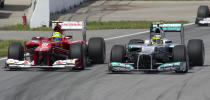 Ferrari driver Felipe Massa (L) of Brazil and Mercedes driver Nico Rosberg of Germany battle for position as they race in the Canadian Formula One Grand Prix on June 10, 2012 at the Circuit Gilles Villeneuve in Montreal. AFP PHOTO/DON EMMERTDON EMMERT/AFP/GettyImages