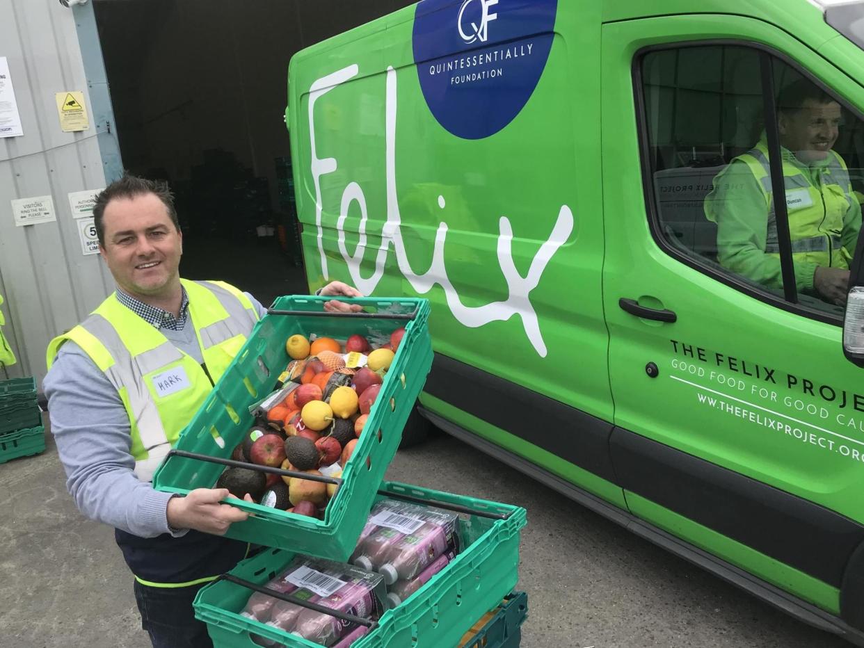 Mark Curtin, CEO of The Felix Project, preparing to stack one of the charity's vans: The Independent