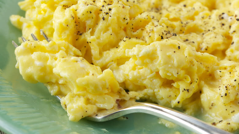 close up of scrambled eggs on plate