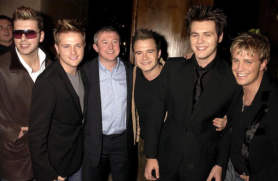 UNITED KINGDOM - NOVEMBER 12:  Westlife With Louis Walsh (westlife Manager), Westlife Celebrated Their Guinness Book Of Records Entry For The Most Public Appearnces In 36 Hours By A Pop Group With A Party At Zuma Restaurant In London  (Photo by Dave Benett/Getty Images)