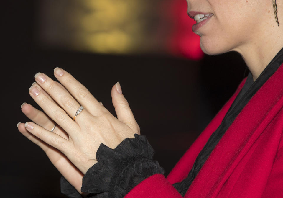 New Zealand Prime Minister Jacinda Ardern gestures as she shows her engagement ring during a media event in Auckland, New Zealand, Monday May 6, 2019. (Michael Craig/New Zealand Herald via AP)