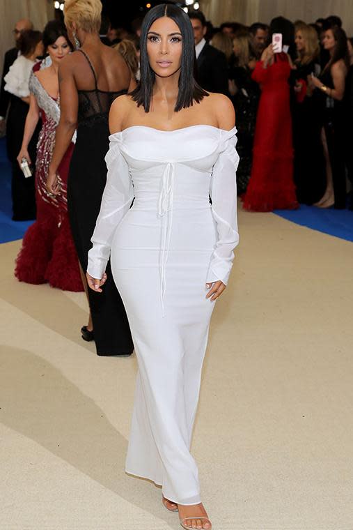 Fresh from her holiday in the sun, Kim stunned on the red carpet in this Vivienne Westwood off-the-shoulder white gown.
