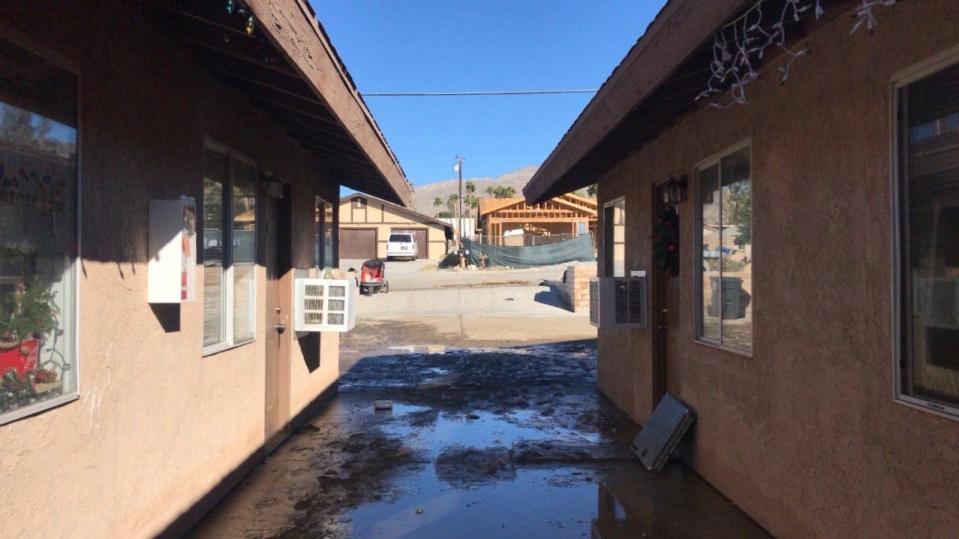 Water from a water main break stands outside an apartment complex on Fourth Street in Desert Hot Springs on Sunday, Dec. 26, 2021.