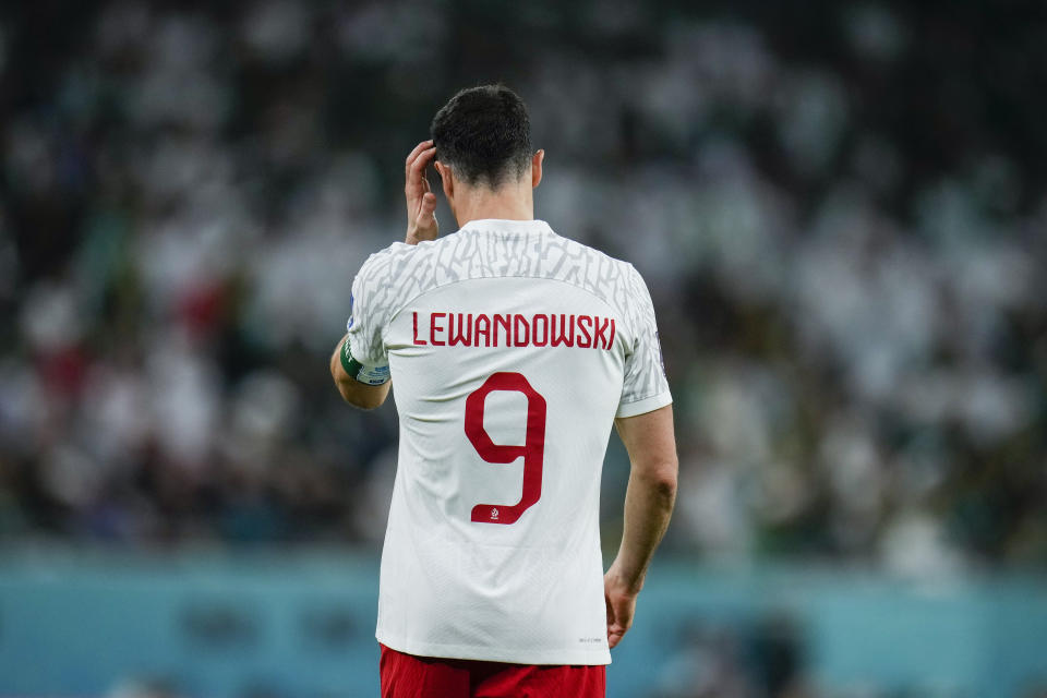 Poland's Robert Lewandowski stands on the pitch during the World Cup group C soccer match between Poland and Saudi Arabia, at the Education City Stadium in Al Rayyan , Qatar, Saturday, Nov. 26, 2022. (AP Photo/Manu Fernandez)