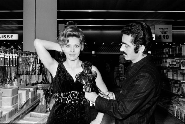 Paco Rabanne tries a creation with cutleries on French actress Corinne Marchand in 1969 (AFP via Getty Images)