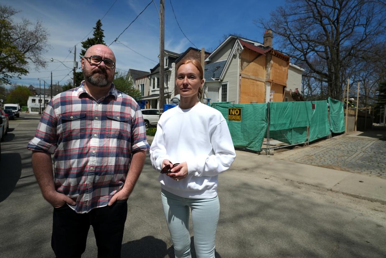 Beaches residents Alex and Tata Shifrin initially supported their neighbours' renovation project. But after construction began, they say it went beyond what they thought they'd agreed to. (Paul Borkwood/CBC - image credit)
