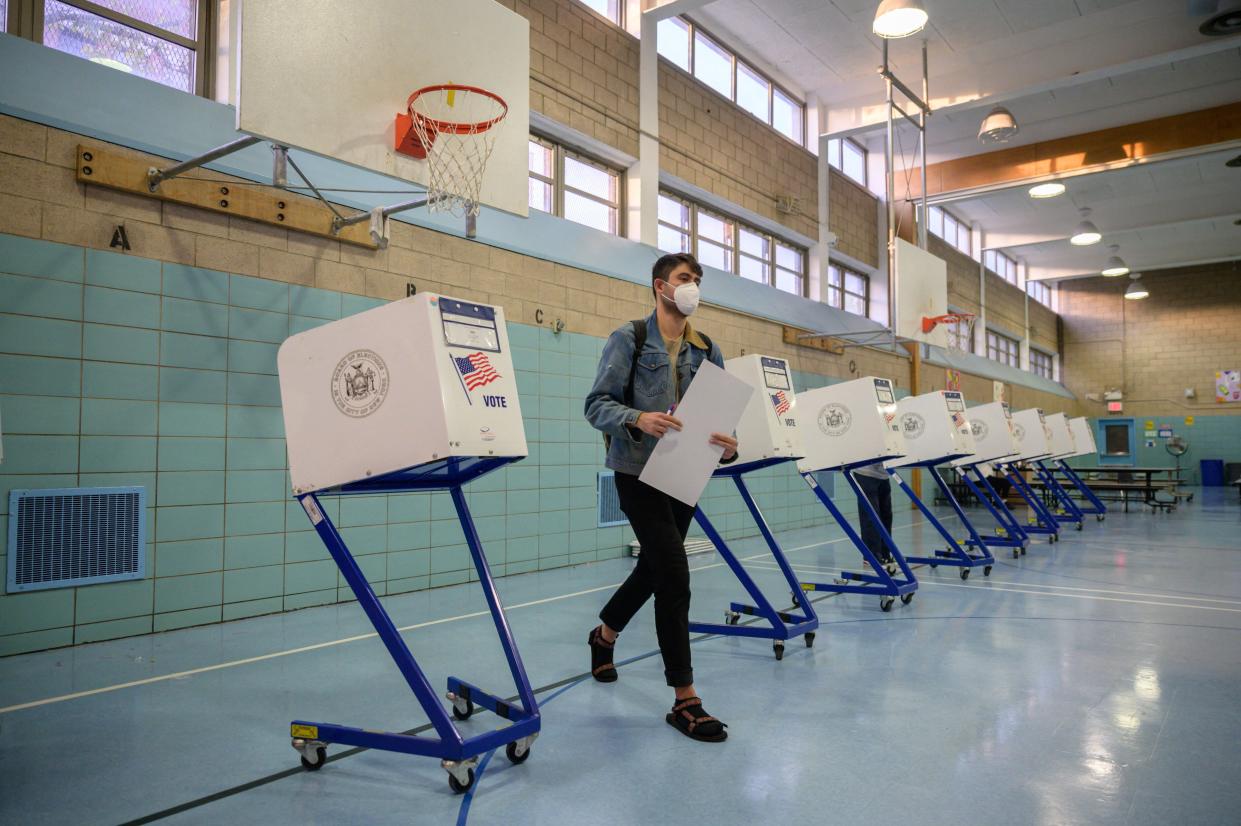 Voters cast their ballots at a voting center in Brooklyn, New York on Nov. 2, 2021. New Yorkers head to the polls in a mayoral election that is virtually guaranteed to elect Black former policeman Eric Adams as the next leader of America's biggest city.