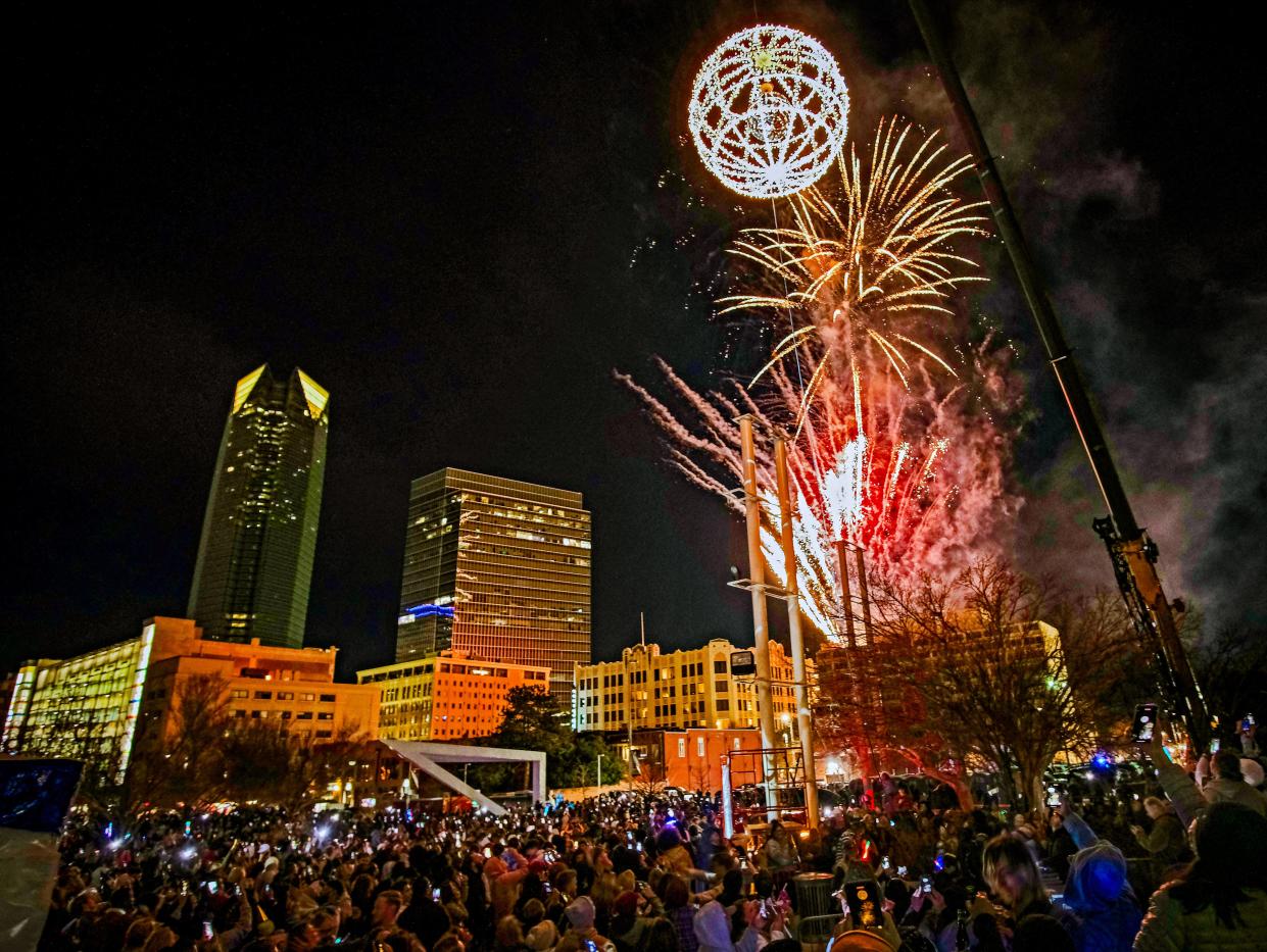 Fireworks go off as the ball rises during Arts Council OKC's New Year's Eve celebration, Opening Night 2023, in Bicentennial Park in downtown Oklahoma City, Saturday, December 31, 2022.