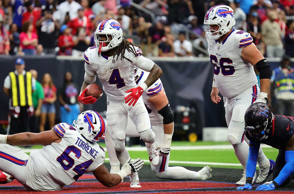 HOUSTON, TEXAS - OCTOBER 06: James Cook #4 of the Buffalo Bills celebrates a touchdown during the third quarter against the Houston Texans at NRG Stadium on October 06, 2024 in Houston, Texas. (Photo by Alex Slitz/Getty Images)