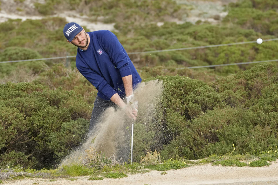 Josh Allen follows his shot from the sand up to the second green of the Spyglass Hill Golf Course during the first round of the AT&T Pebble Beach Pro-Am golf tournament in Pebble Beach, Calif., Thursday, Feb. 2, 2023. (AP Photo/Eric Risberg)