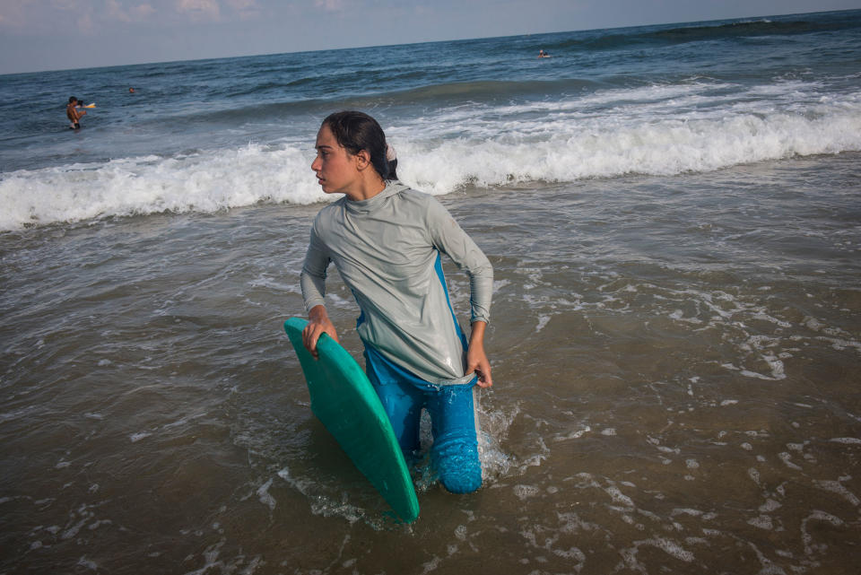 <p>For many Gazans the sea is the only place they can be without being reminded of their isolation. Female Surfer, Sabah Abu Ghanem ,14 and her sister surf early in the morning outside of Gaza city. The sisters place first in many competitions inside the strip, but have never left the Gaza Strip to compete. (Photograph by Monique Jaques) </p>