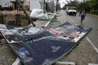 A billboard lays on the ground, toppled by Hurricane Zeta in Playa del Carmen, Mexico, early Tuesday, Oct. 27, 2020. Zeta is leaving Mexico’s Yucatan Peninsula on a path that could hit New Orleans Wednesday night. (AP Photo/Tomas Stargardter)