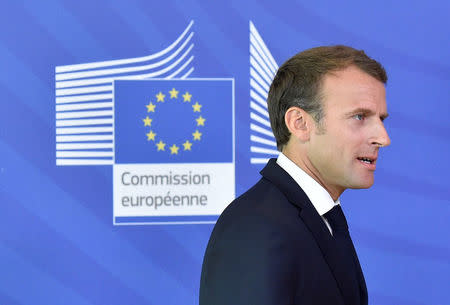 French President Emmanuel Macron walks after arriving to take part in an emergency European Union leaders summit on immigration, in Brussels, Belgium June 24, 2018. REUTERS/Eric Vidal