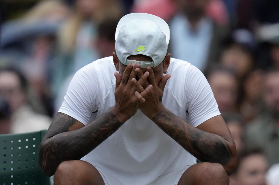 Australia's Nick Kyrgios during a break in his third round men's singles match against Greece's Stefanos Tsitsipas on day six of the Wimbledon tennis championships in London, Saturday, July 2, 2022. (AP Photo/Kirsty Wigglesworth)
