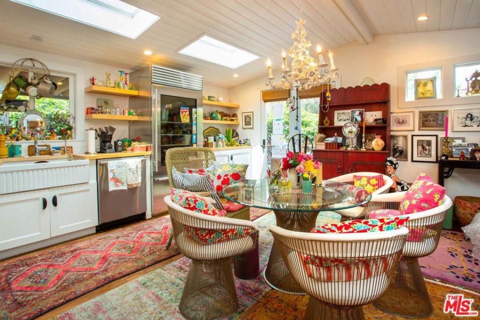 <div class="inline-image__caption"><p>On those days when the notoriously awful Malibu weather drives you indoors (as if!), invite your posh park neighbors to a little wining and dining in the kitchen where Johnson has proven that any space is a good space to pair vintage florals with a statement chandelier. </p></div> <div class="inline-image__credit">Trulia</div>