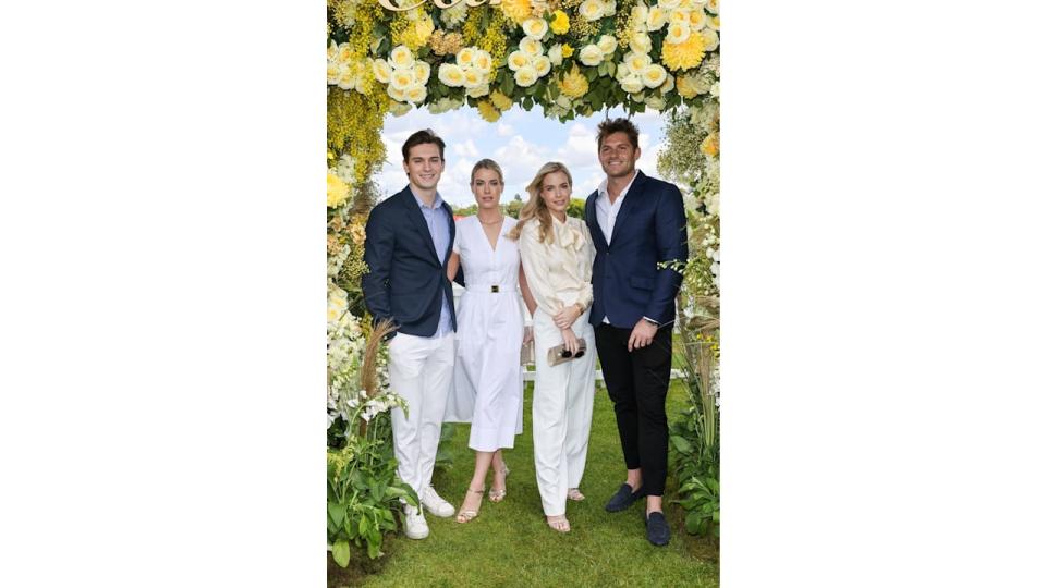 Samuel Aitken, Lady Eliza Spencer, Lady Amelia Spencer and Greg Mallett pose under floral arch