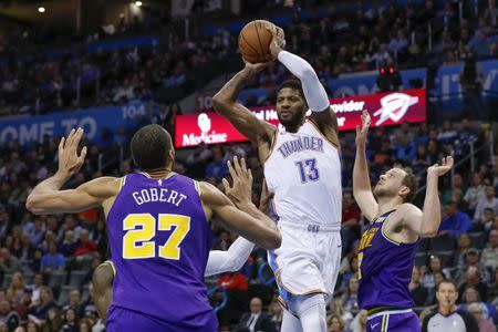 Dec 10, 2018; Oklahoma City, OK, USA; Oklahoma City Thunder forward Paul George (13) looks to pass over Utah Jazz center Rudy Gobert (27) during the first half at Chesapeake Energy Arena. Alonzo Adams-USA TODAY Sports