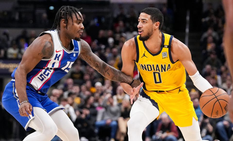 Indiana Pacers guard Tyrese Haliburton (0) rushes up the court against Sacramento Kings guard Davion Mitchell (15) on Friday, Feb. 2, 2024, during the game at Gainbridge Fieldhouse in Indianapolis.