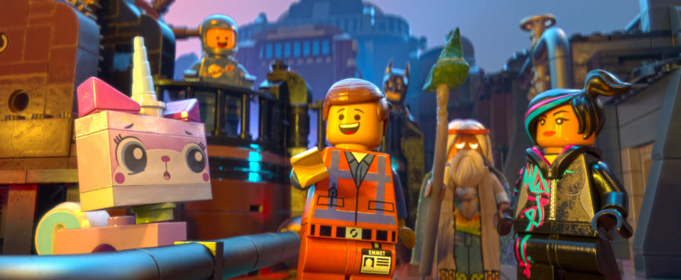 THE LEGO MOVIE, from left: Unikitty (voice: Alison Brie), Benny (voice: Charlie Day), Emmet (voice: Chris Pratt), Batman (voice: Will Arnett), Vitruvius (voice: Morgan Freeman), Wyldstyle (voice: Elizabeth Banks), 2014, ©Warner Bros. Pictures/courtesy Everett Collection