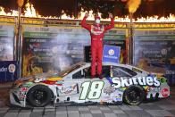 Kyle Busch celebrates in Victory Lane after winning the NASCAR Cup Series auto race at Texas Motor Speedway in Fort Worth, Texas, Wednesday, Oct. 28, 2020. (AP Photo/Richard W. Rodriguez)