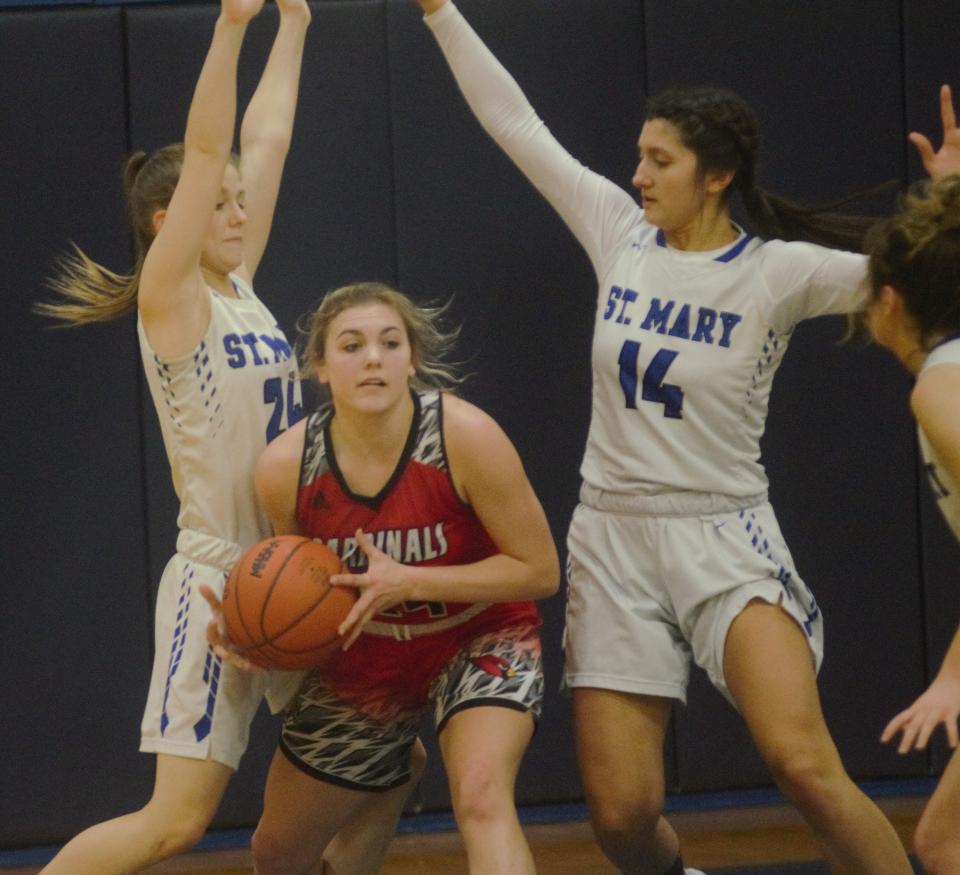 Jayden Marlatt looks to pass out of a trap during a girls basketball matchup between Gaylord St. Mary's and Johannesburg-Lewiston on Thursday, February 16 in Gaylord, Mich.