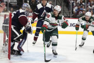 Minnesota Wild right wing Mats Zuccarello (36) pursues the puck as Colorado Avalanche goaltender Darcy Kuemper, left, looks on in the second period of an NHL hockey game Monday, Jan. 17, 2022, in Denver. (AP Photo/David Zalubowski)