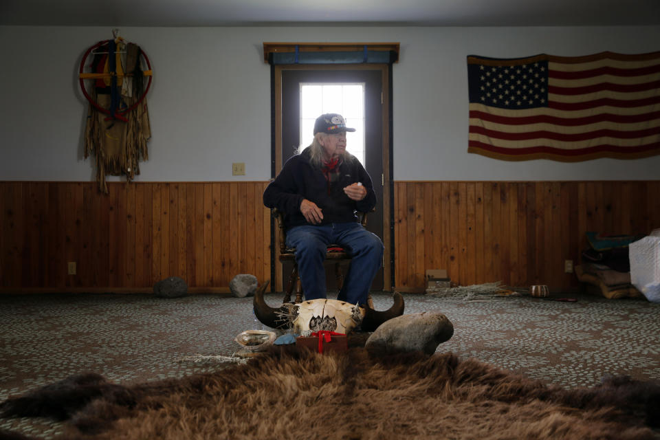 Basil Brave Heart, 88, who attended Red Cloud Indian School when it was known as Holy Rosary Mission, sits for an interview Sept. 30, 2021, in Pine Ridge, S.D. "Physical abuse was difficult. But when they took my language away, they took my moral compass," Brave Heart said. "The language we speak is the way you think, the way you pray and the way you conduct your ceremonies." (AP Photo/Emily Leshner)