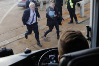 Britain's Prime Minister Boris Johnson runs to his campaign bus after a visit to Wilton Engineering Services, part of a General Election campaign trail in Middlesbrough, England, Wednesday, Nov. 20, 2019. Britain goes to the polls on Dec. 12. (AP Photo/Frank Augstein, Pool)