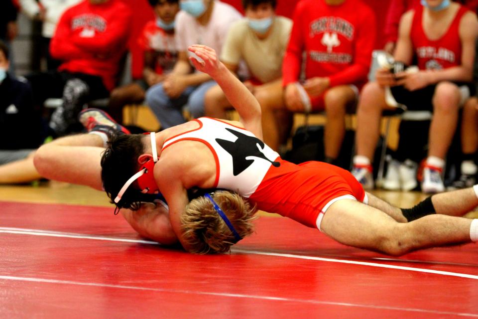 Fox Lane's Justin Gierum attempts to pin Pearl River's Aidan Veirun during the 132-pound match of the 2021-22 Section 1 Division I Dual Meet Tournament opening round. Gierum won the match, 7-0.