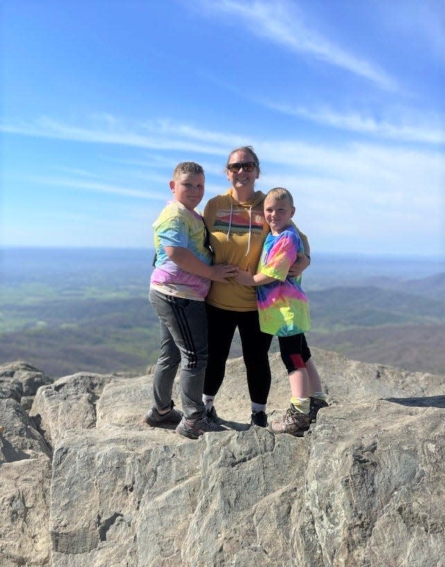 Meghan Megill with her children after losing 108 pounds on Friday, April 22, 2022.