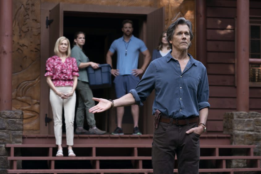 Kevin Bacon in ‘They/Them.’ Behind him, in pink blouse, is Carrie Preston - Credit: Peacock/Photo by: Josh Stringer/Blumhouse