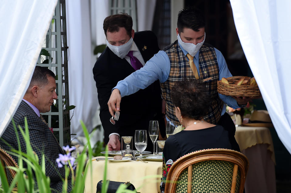 Customers dine outside at The Inn at Little Washington, one of the countrys most renowned restaurants, on the first day of Virginia's phase one reopening in Washington, Virginia on May 29, 2020. - Today marks the beginning of phase one in the state with restaurants reopening following the stay at home orders from the COVID-19 pandemic, provided they can serve customers outdoors with groups sitting at least 6 feet apart. (Photo by Olivier DOULIERY / AFP) (Photo by OLIVIER DOULIERY/AFP via Getty Images)