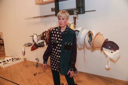 Artist Helen Marten poses for photographs with her work entitled 'Brood and Bitter Pass' after being announced as the winner of the Turner Prize at the Tate Gallery in London, Britain December 5, 2016. REUTERS/Eddie Keogh