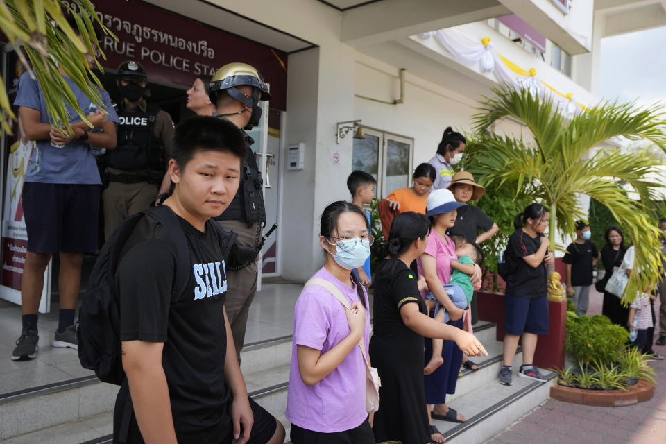 Members of the Shenzhen Holy Reformed Church, also known as the Mayflower Church, leave from the Nongprue police station on their way to Pattaya Provincial Court in Pattaya, Thailand, on March 31, 2023. More than 60 self-exiled members of a Chinese Christian church who were detained in Thailand after receiving U.N. refugee status will be deported by next week, probably to a third country, officials said Wednesday, April 5. (AP Photo/Sakchai Lalit)