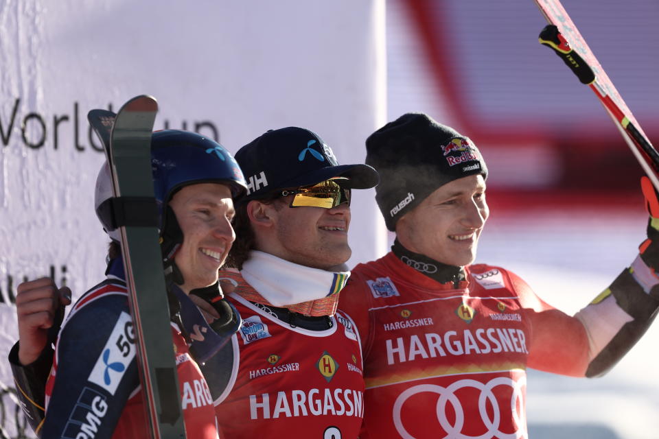 From left, second placed Norway's Henrik Kristoffersen, the winner Norway's Lucas Braathen and third placed Switzerland's Marco Odermatt celebrate after an alpine ski, men's World Cup giant slalom, in Alta Badia, Italy, Sunday, Dec. 18, 2022. (AP Photo/Gabriele Facciotti)