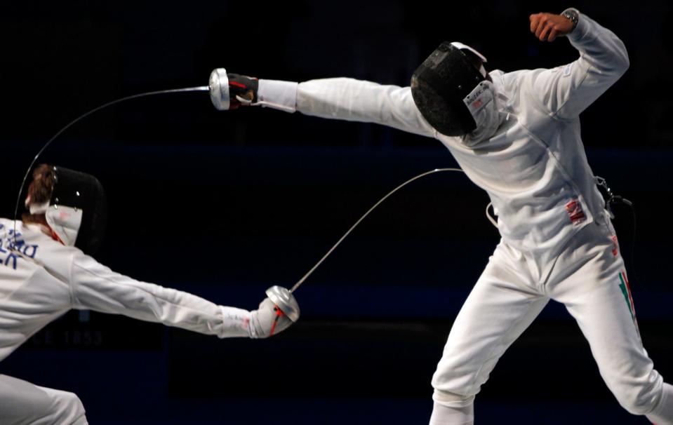 Two people fencing